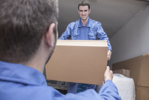 Professional house removals team loading furniture in Catford