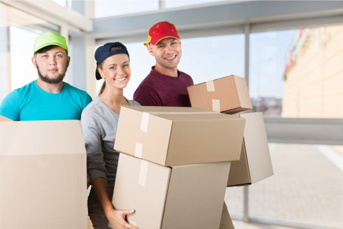 Removal van and packed boxes during a house move in Catford