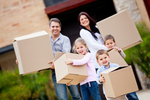 House removals crew carrying furniture in Catford